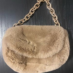 Fur bag with gold strap